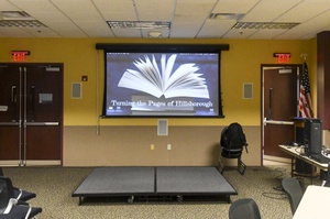 Stage at the public library multi-purpose room for Turning the Pages of Hillsborough